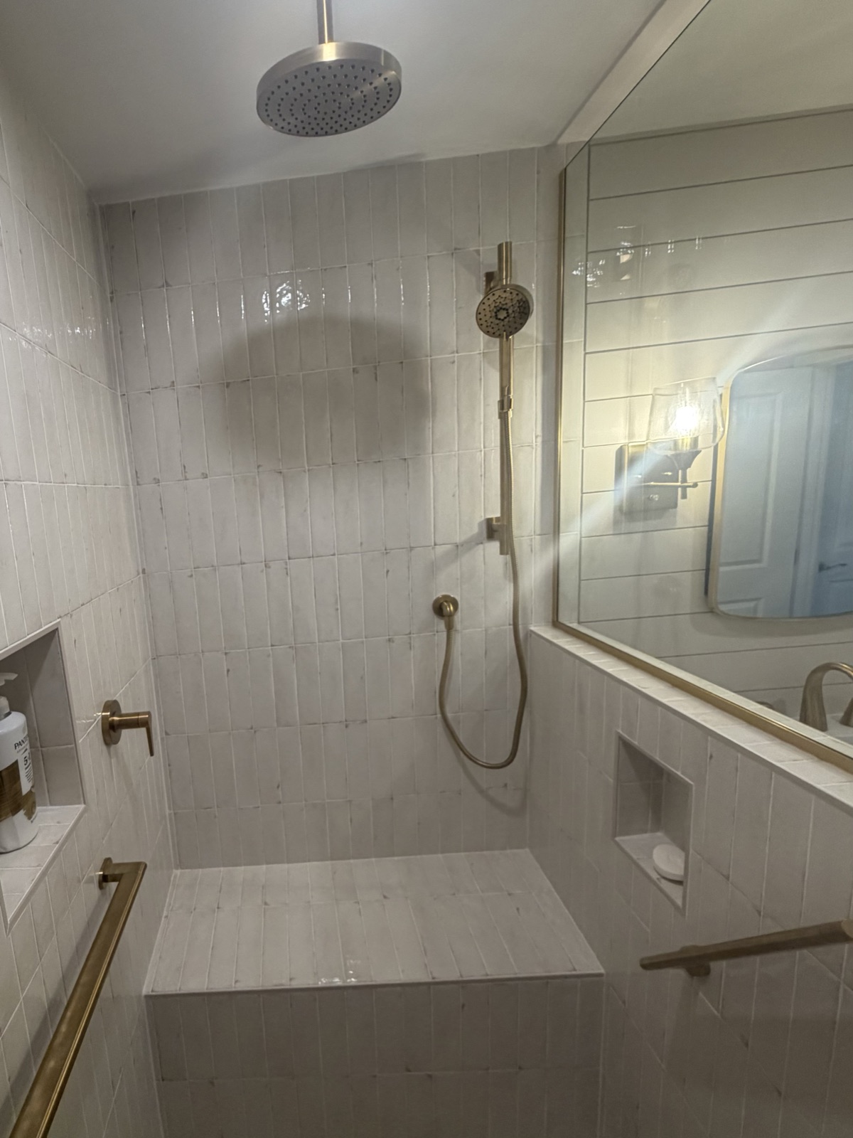 Finished aging-in-place bathroom with spa finishes and accessible shower details