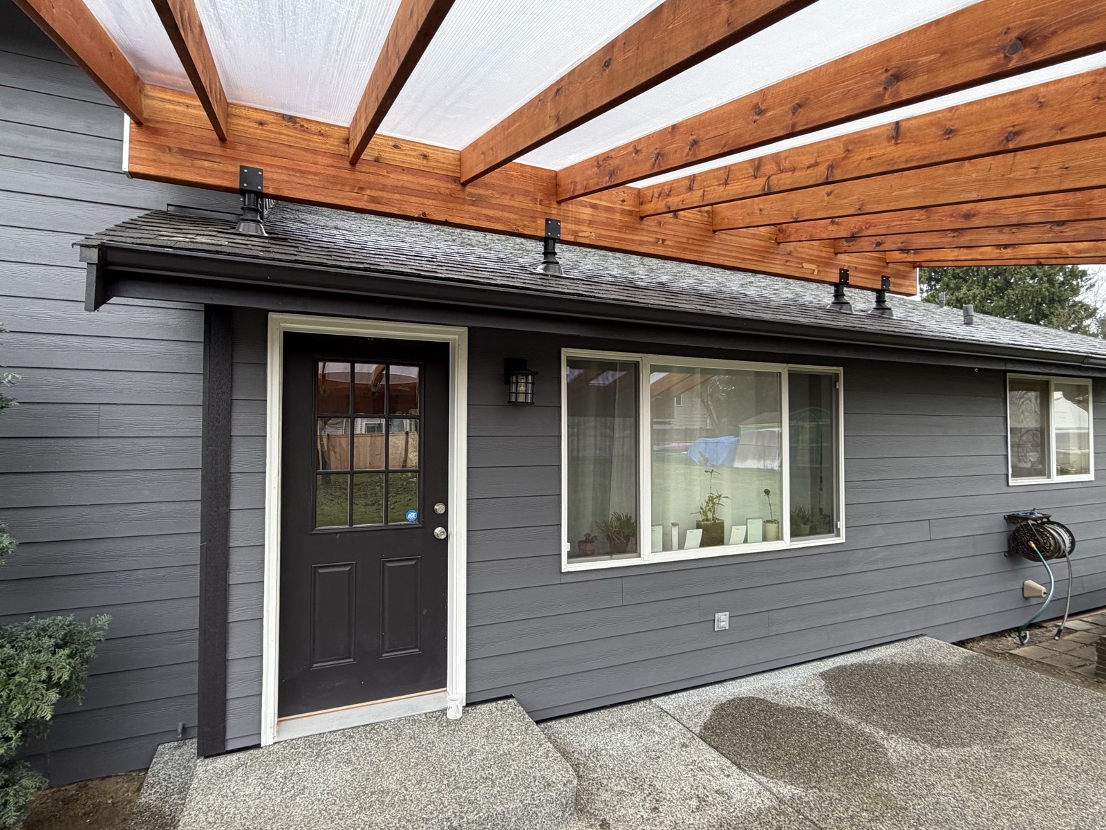 Finished cedar patio cover with translucent roof panels