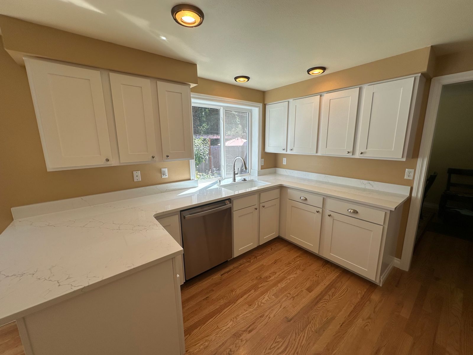 Kitchen remodel with quartz counters and white cabinets