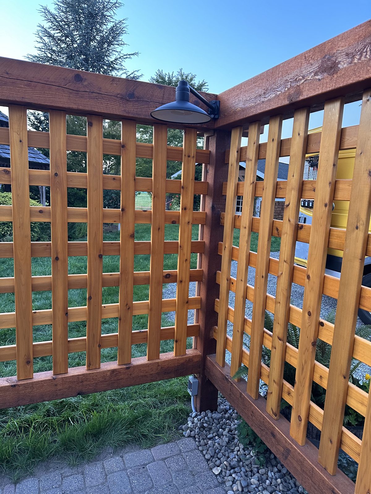 Cedar lattice corner with barn-style light