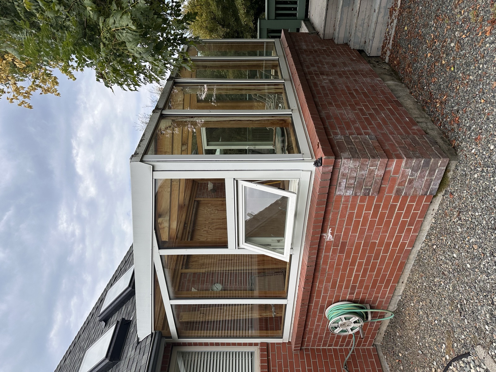 Original aluminum and glass sunroom before conversion to an integrated deck